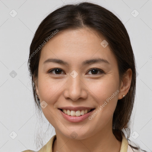 Joyful white young-adult female with medium  brown hair and brown eyes