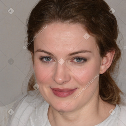 Joyful white young-adult female with medium  brown hair and blue eyes