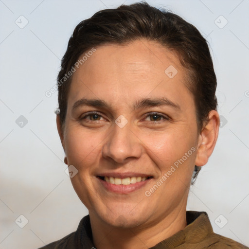 Joyful white adult female with short  brown hair and brown eyes