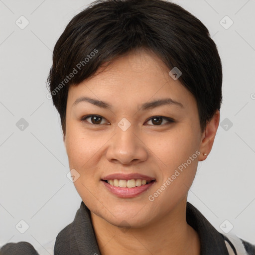 Joyful asian young-adult female with short  brown hair and brown eyes