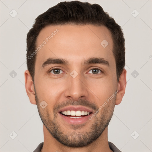 Joyful white young-adult male with short  brown hair and brown eyes