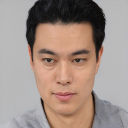 Neutral asian young-adult male with short  black hair and brown eyes