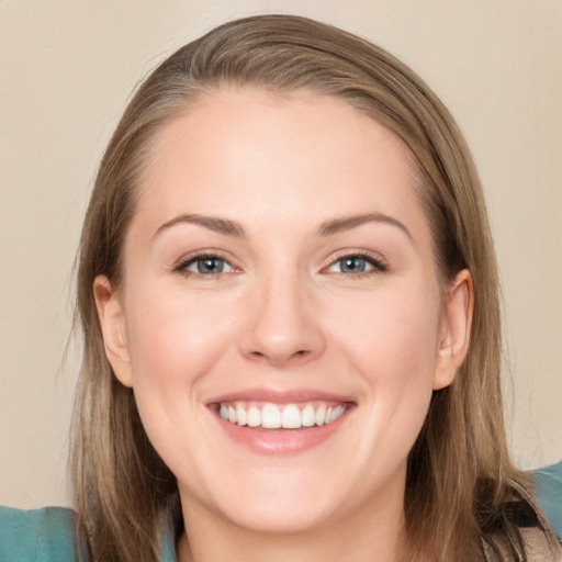 Joyful white young-adult female with long  brown hair and grey eyes