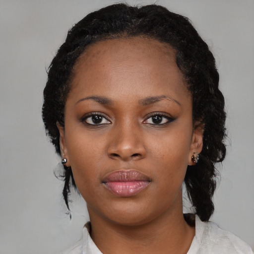 Neutral black young-adult female with medium  black hair and brown eyes