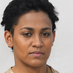 Joyful latino young-adult female with short  brown hair and brown eyes