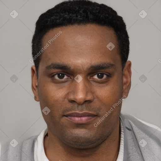 Joyful black young-adult male with short  black hair and brown eyes