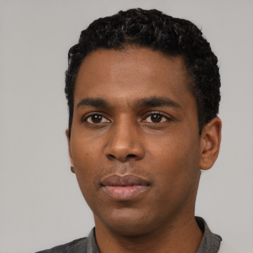Neutral black young-adult male with short  black hair and brown eyes
