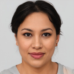 Joyful asian young-adult female with medium  brown hair and brown eyes