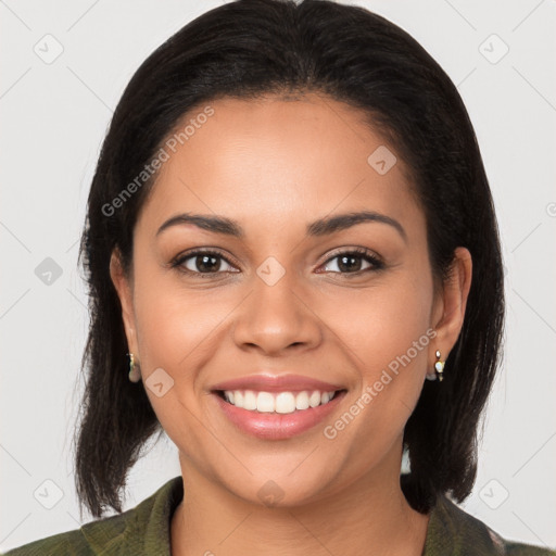 Joyful latino young-adult female with medium  brown hair and brown eyes