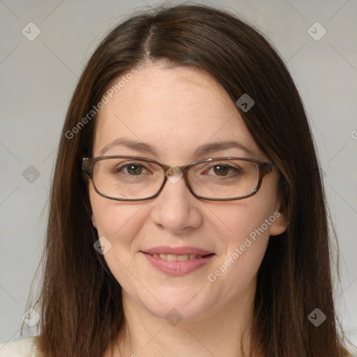 Joyful white adult female with long  brown hair and brown eyes