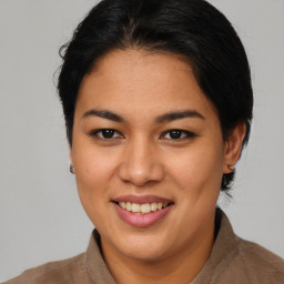 Joyful asian young-adult female with medium  brown hair and brown eyes