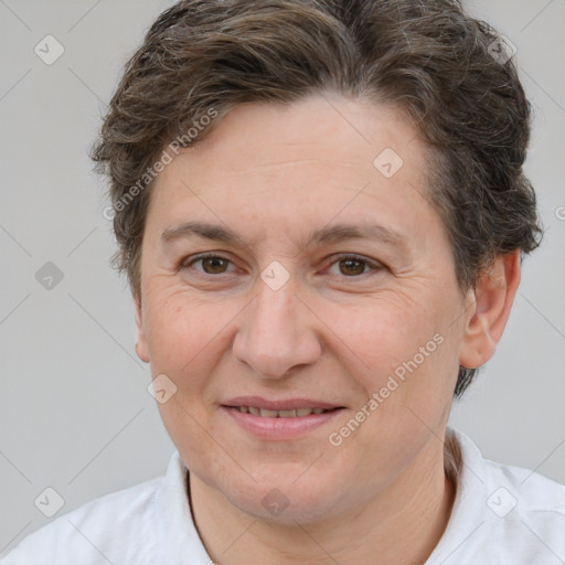 Joyful white adult female with short  brown hair and brown eyes