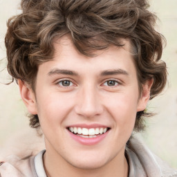 Joyful white young-adult male with medium  brown hair and green eyes