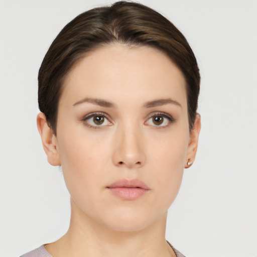 Neutral white young-adult female with short  brown hair and brown eyes