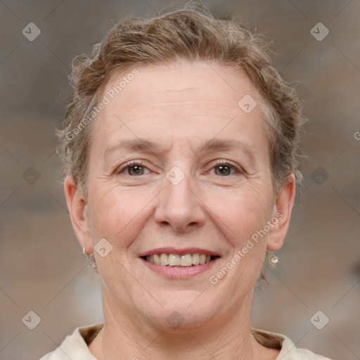 Joyful white adult female with short  brown hair and brown eyes