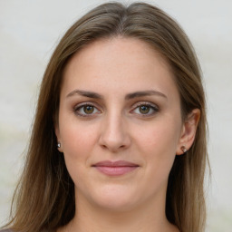 Joyful white young-adult female with long  brown hair and green eyes