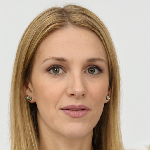 Joyful white young-adult female with long  brown hair and green eyes