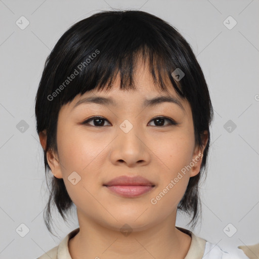 Joyful asian young-adult female with medium  black hair and brown eyes