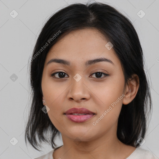 Joyful asian young-adult female with medium  black hair and brown eyes