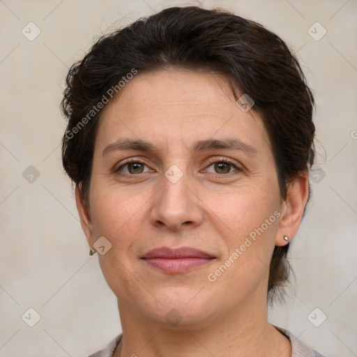 Joyful white adult female with short  brown hair and brown eyes