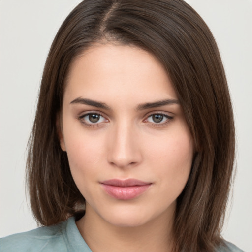 Neutral white young-adult female with medium  brown hair and brown eyes