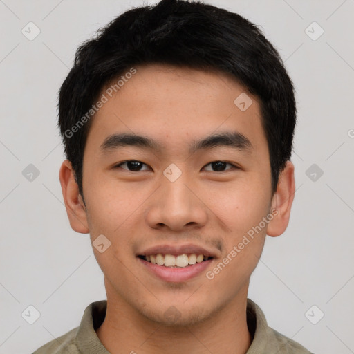 Joyful asian young-adult male with short  black hair and brown eyes