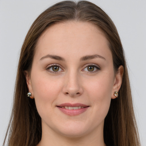 Joyful white young-adult female with long  brown hair and grey eyes