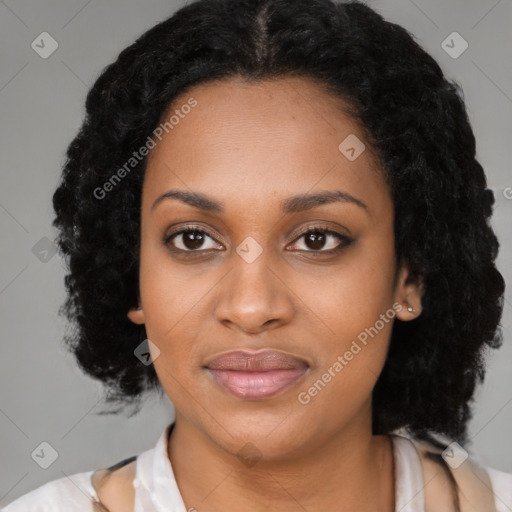 Joyful black young-adult female with medium  black hair and brown eyes