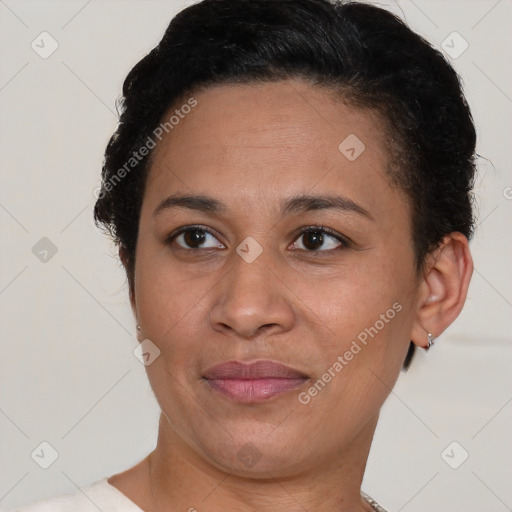 Joyful black adult female with short  brown hair and brown eyes