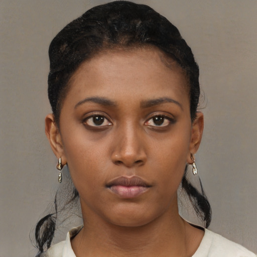 Neutral black young-adult female with short  brown hair and brown eyes
