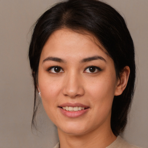 Joyful white young-adult female with medium  brown hair and brown eyes