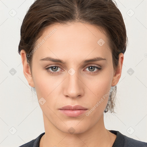 Neutral white young-adult female with medium  brown hair and brown eyes