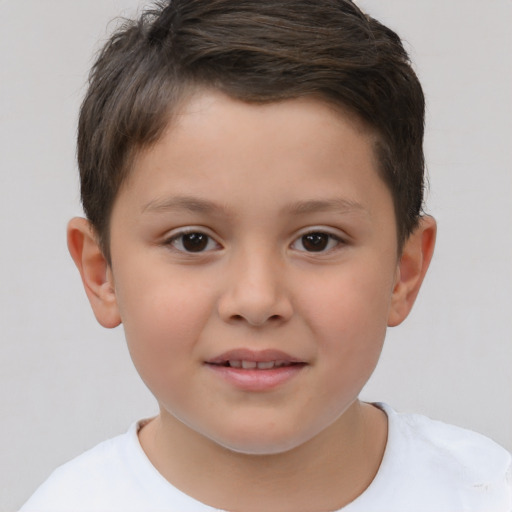 Joyful white child male with short  brown hair and brown eyes