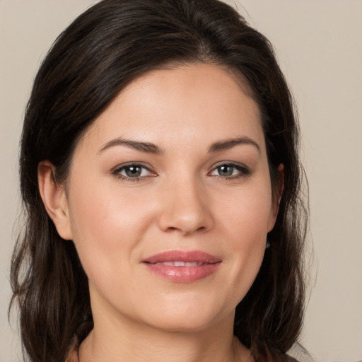 Joyful white young-adult female with medium  brown hair and brown eyes