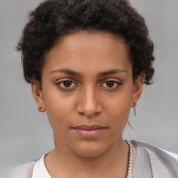 Neutral white young-adult female with short  brown hair and brown eyes