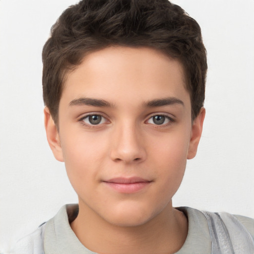 Joyful white child male with short  brown hair and brown eyes