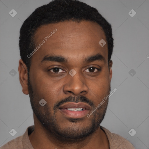 Joyful latino young-adult male with short  brown hair and brown eyes