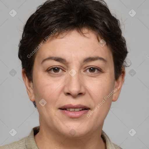 Joyful white adult female with short  brown hair and brown eyes