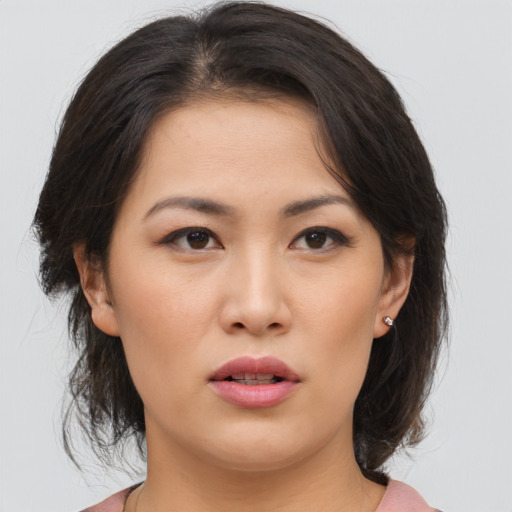 Neutral asian young-adult female with medium  brown hair and brown eyes