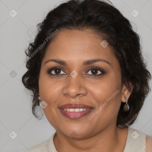 Joyful black adult female with medium  brown hair and brown eyes