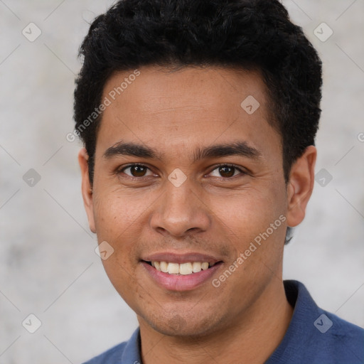 Joyful white young-adult male with short  black hair and brown eyes