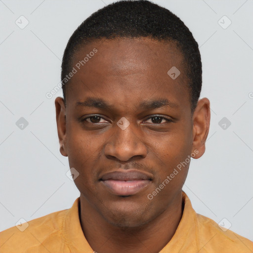 Joyful black young-adult male with short  brown hair and brown eyes