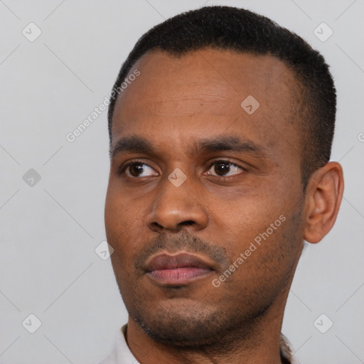 Neutral black young-adult male with short  black hair and brown eyes