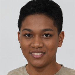 Joyful black young-adult female with short  black hair and brown eyes