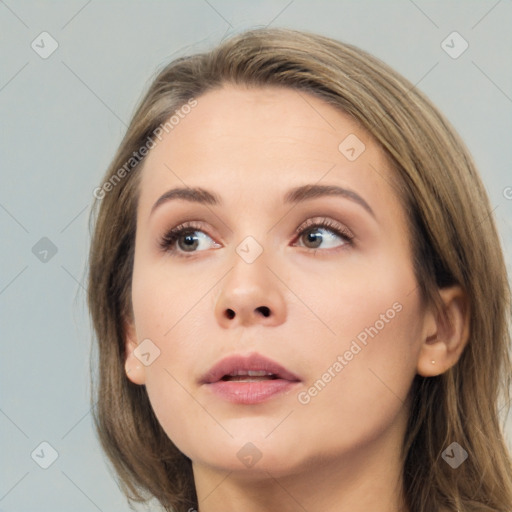 Neutral white young-adult female with long  brown hair and brown eyes