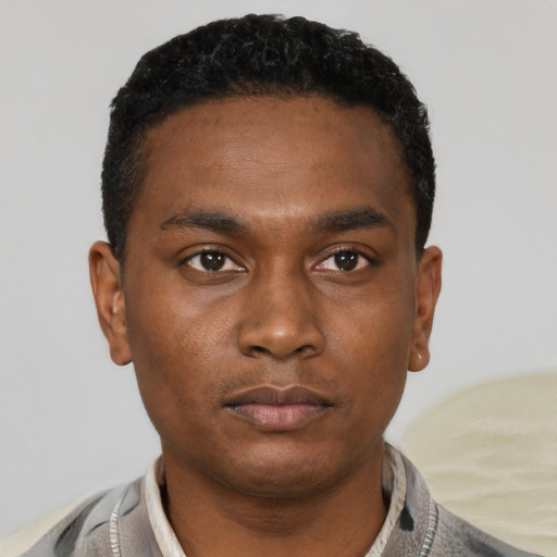 Neutral black young-adult male with short  black hair and brown eyes