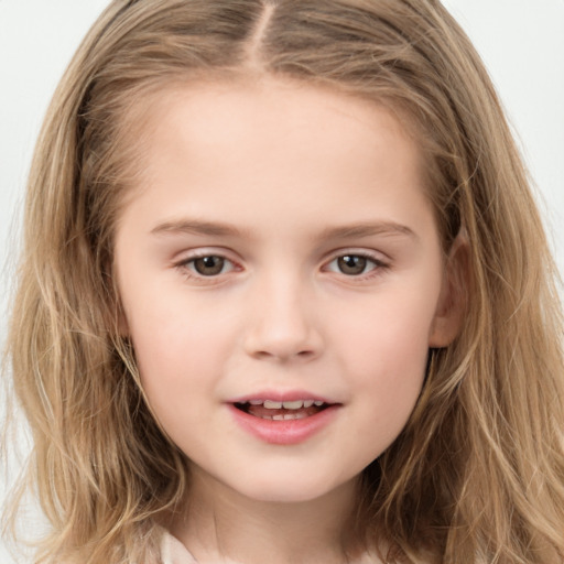 Joyful white child female with long  brown hair and brown eyes