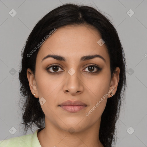 Joyful latino young-adult female with long  black hair and brown eyes