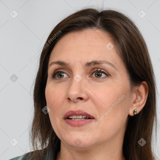 Joyful white adult female with medium  brown hair and brown eyes