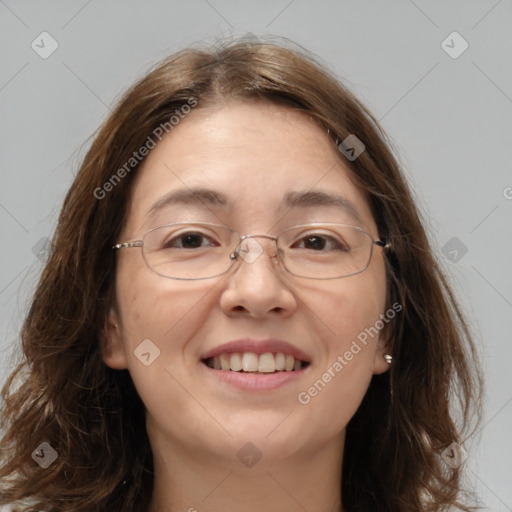 Joyful white adult female with long  brown hair and brown eyes